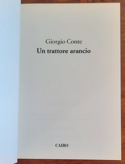 Un trattore arancio - di Giorgio Conte